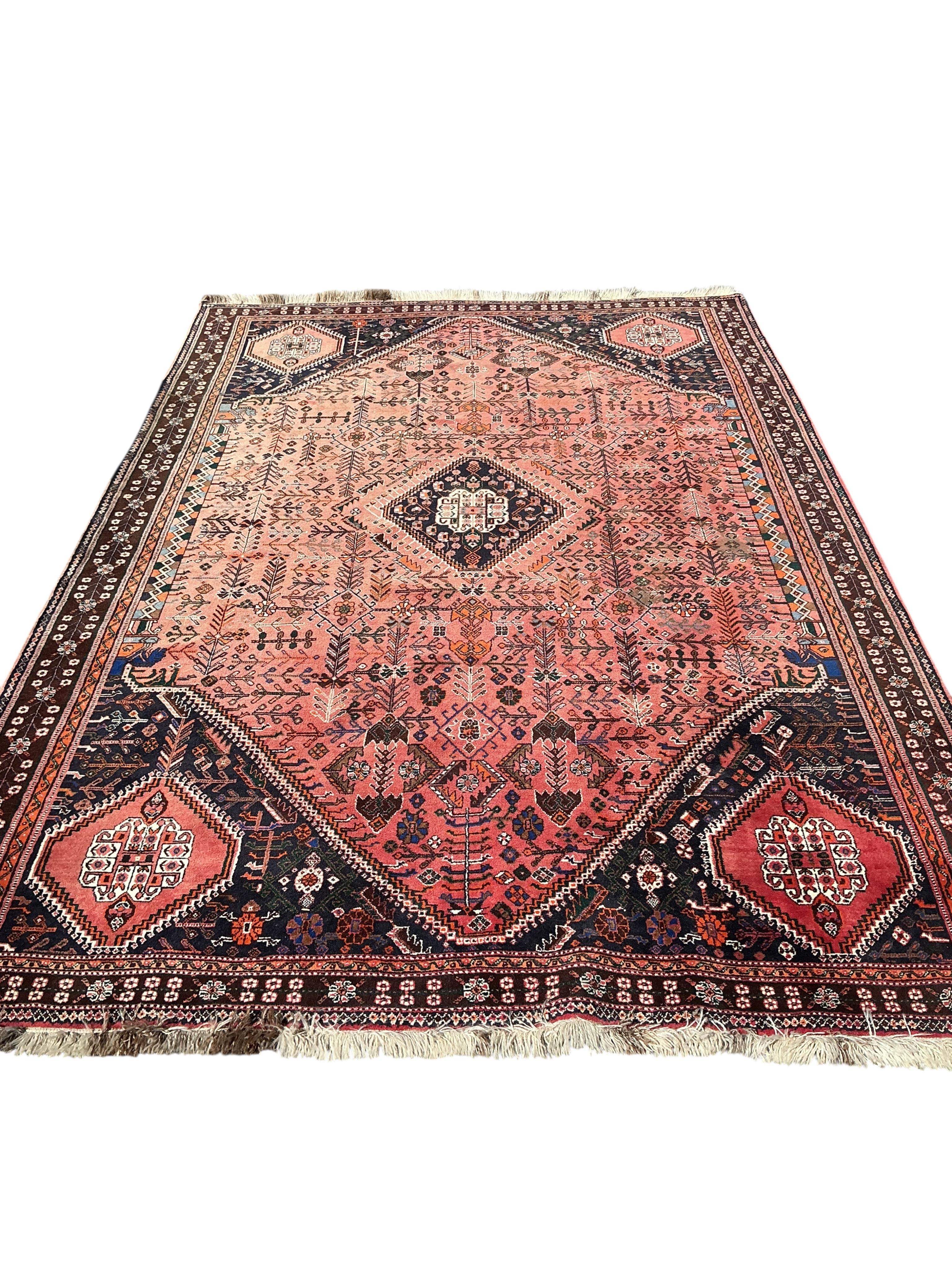 A Hamadan red ground carpet, 311 x 210cm